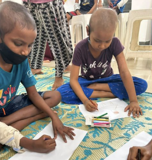 Children drawing during a creative activity at St. Jude India ChildCare Centres