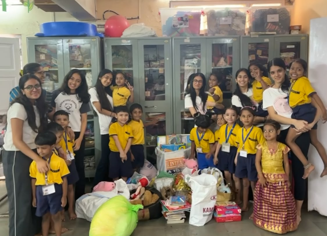 Books and toys donation group photo